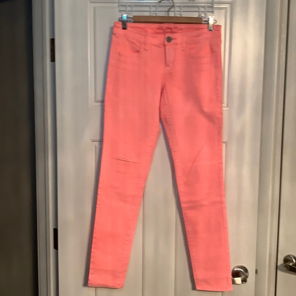 American eagle low rise denim stretch neon orange jeans.